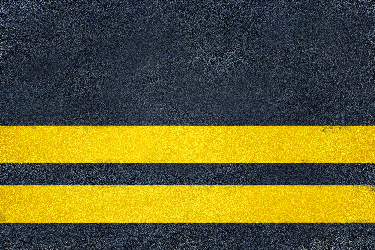 Yellow stripes on asphalt